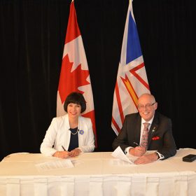 Representatives signing agreement